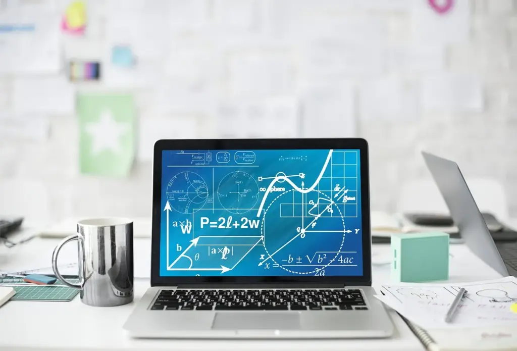 Refinance calculator and laptop for comparing fixed vs adjustable mortgage rates