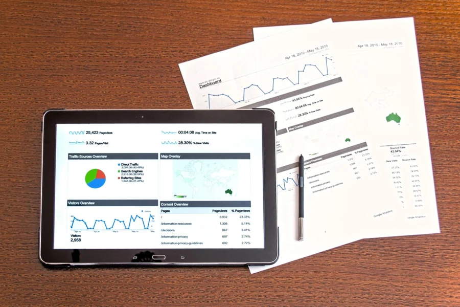 A close-up of a credit score report with a person's hand pointing at it