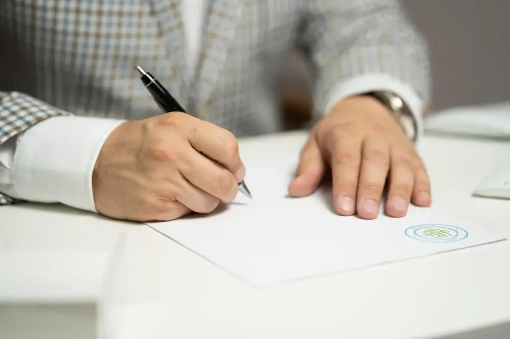 Veteran holding a DD Form 214 and Certificate of Eligibility